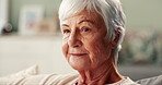 Happy, senior woman and thinking on couch with memories, nostalgia and thoughts of past history with gratitude. Female elderly person, remember and peaceful in retirement home, relax and calm on sofa