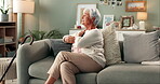 Senior, woman and thinking with photograph on sofa for reminiscing, nostalgia and remember memory of history or past. Elderly person, home and thoughts on couch with picture, missing and mourning.