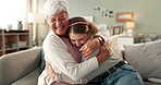 Love, hug and woman on sofa with grandmother with smile, bonding and senior care in living room. Respect, embrace and girl on couch together with grandma for support, comfort and happiness in home.