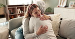 Comfort, hug and woman on sofa with grandmother with smile, bonding and senior care in living room. Respect, embrace and girl on couch together with grandma for support, love and happiness in home.