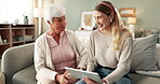 Tablet, grandmother and daughter music, listen and song online in home. Technology, earphones and radio for streaming videos on internet, digital and family for retired female person in living room