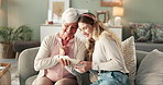 Grandmother, daughter and looking with photo frame on sofa, relax and conversation with memories of past history. Girl, elderly person and happiness in home on couch with photograph of childhood.