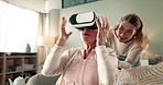 Grandma, daughter and VR with fright on sofa in virtual gaming, match or shock in living room at home. Surprised grandmother and laugh with funny grandchild, humor or comedy on lounge couch at house