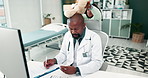 Doctor, African man and girl with bear, toys and surprise with play in office at hospital with games. Father, daughter and funny with writing for medical report, frustrated or results with documents