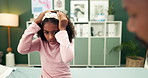 Little girl, headache and checkup with doctor for consultation, pain or diagnosis at clinic. Young child or sick kid talking to medical worker on migraine for illness, exam or mental health at clinic