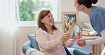 Nurse, retirement home and senior woman with mirror for brush hair, kindness and happy smile for beauty. Caregiver, elderly person and grooming in hospice with reflection for hairstyle and aesthetic