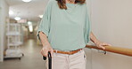 Hands, hospital or walking stick and person with disability in corridor for recovery or rehabilitation. Balance, stability or support and patient in health clinic with cane for assistance or help