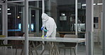 Person, disinfect and cleaning with hazmat suit in laboratory for germs, virus exposure or prevent infection. Biohazard, sanitize and man with ppe for decontamination, chemical or hazardous waste