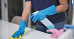 Hands, wipe and liquid for cleaning counter in home, disinfection and maid for housekeeping. Woman, maintenance service and chemical treatment to prevent germs, bacteria and disease for health safety