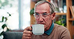 Home, relax and senior man with coffee, retirement and happiness with morning tea in living room. Mature guy, apartment and pensioner with cup, cappuccino and espresso with peace and calm in lounge