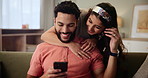 Happy couple, hug and love with phone on sofa for good news, embrace or care in living room at home. Man and woman in relax with smile on mobile smartphone for online browsing, bonding or comfort