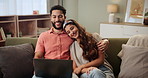 Happy couple, relax and laughing with laptop on sofa for funny movie, streaming or comedy at home. Man and woman with smile, hug or cuddle on computer for online entertainment in living room at house