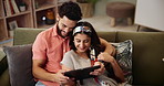 Couple, hug and tablet together on sofa, home and watching video or online streaming for movies and bonding. Internet, networking and social media in living room, care and affection with technology