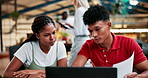 College, students and friends learning on laptop together for studying, education or knowledge. Teamwork, university and people on computer in discussion for test, exam or creative research document