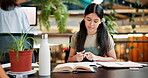 Student, woman and studying in library with textbook, notes and highlight for exam preparation. Education, university and knowledge for project or studies for female person, collage and academics 