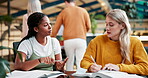 Woman, friends and learn in library, studying and books for exam on campus. Conversation, hand and writing notes for help and communication for female students, education and speaking with teamwork