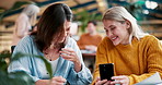 Coffee shop, laugh and women with phone in restaurant for bonding, chatting and relax together. Cafe, friends and people on smartphone for social media, internet meme and funny website with drink