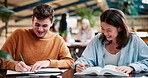 Library, university and students with books for learning,  studying and reading together. Education, college and man and woman with notes, textbooks and writing for knowledge, discussion and help