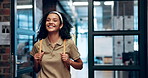 Happy, backpack and student in a university classroom with confidence and happy from learning. College library, master candidate and smile at a school with education, scholarship and book bag