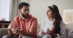 Home, discussion and couple with coffee on sofa in morning, commitment and talking together. Married people, man and woman with conversation on couch for support, serious and marriage in relationship