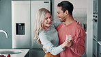 Home, dancing and couple with love, energy and relationship with happiness, romance and bonding together. Kitchen, support or man with woman, marriage or joy for anniversary, smile or care with trust