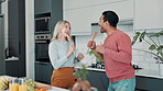 Happy, couple and singing or dancing in kitchen with cooking preparation for bonding, fun and relationship goals. Excited, woman and man with smile for quality time and romantic memory on date night