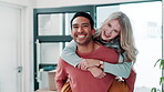 Couple, piggyback and new home for moving, excited and walking in front door with real estate property or dream. Excited interracial people or young man and woman with tour of house for immigration
