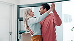 Couple, dance and new home with moving, celebration and success in front door for real estate, property or mortgage. Excited interracial people or young man and woman hug together for house security