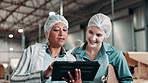 Shipping, woman and manager with tablet in factory for inspection, inventory check or distribution. Discussion, industrial and mature person with cargo employee for logistics, export or supply chain