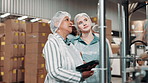 Logistics, woman and manager with tablet in factory for inspection, inventory check or distribution. Discussion, industrial and mature person with cargo employee for shipping, export or supply chain
