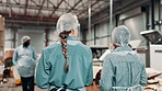 Women, teamwork and factory inspection for supply chain shipping with hair net for safety, regulations or hygiene. Workers, talking and back in warehouse for delivery distribution, packaging or stock