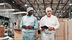 Logistics, man and manager with tablet in warehouse for inspection, inventory check or distribution. Discussion, industrial and mature person with cargo employee for shipping, export or supply chain