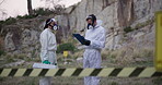Forensic, inspector and teamwork for outdoor investigation with clipboard, discussion or briefing with hazmat suit. Waste management, people or protection service in nature for safety or biohazard