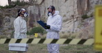 Forensic, inspector or team for outdoor investigation with clipboard, discussion or hazard tape with hazmat suit. Waste management, people or protection in nature for safety or area disinfectant