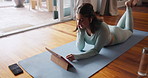 Woman, tablet and stream for fitness, tutorial and online video browse with smile. Influencer, social media and internet for yoga, pilates or workout research with exercise podcast at home or house