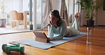 Woman, tablet and podcast for fitness, tutorial and online video stream with smile. Influencer, social media and internet for yoga, pilates or workout research with exercise browse at home or house