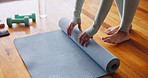 Hands, yoga mat and roll up for workout, fitness and wellness routine for health or weightloss. Person, wooden floor and exercise with training, meditation and zen for peace and holistic mindfulness