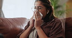 Sick, allergies and woman on sofa sneezing into tissue with flu, burnout or viral infection in her home. Bacteria, toilet paper and girl in living room with virus, lines or nasal congestion in house