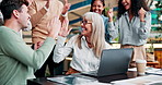 Teamwork, high five and business people on computer with success, victory and achievement. Creative startup, collaboration and men and women celebrate for good news, bonus and winning on laptop