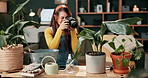 Gardening, photography and woman with plants in home for post on social media, blog and online tips. House, monstera and girl filming leaves with camera for creative project, art or pride for growth