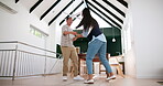 Man, woman and dancing in home for happy bonding in new apartment, celebration or connection. Couple, living room and moving as purchase achievement or playful, relationship or house, laughing or fun