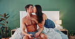 Kiss, bedroom and couple in home for love, support and bonding together to relax with phone. Intimacy, man and woman in bed for romance, connection and commitment for healthy relationship in house