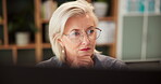 Mature woman, computer and glasses in office, CEO and professional for solution at startup company. Female person, employee and thinking on proposal at workplace, check email and online reflection