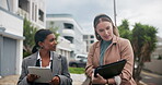 Businesswoman, colleagues and walking with tablet, neighborhood and discussion for policy. Estate agents,  employees and talking with documents, technology and survey for data or results in city 