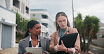 Business woman, colleagues and walking with tablet in neighborhood for discussion on policy. Female person or young employees talking with documents and technology for survey, data or results in city