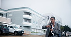 Indian woman, umbrella and running late to work with business, travel or time management in neighborhood. Female person or worried employee checking watch in rush or hurry for commute in urban town