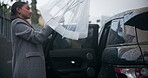 Woman, car and transport or umbrella for raining weather or transportation service in city, chauffeur or driver. Businessperson, vehicle and downtown cab or taxi for work commute, street or winter