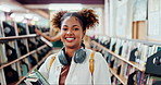 Education, face and happy black woman in library of college or university for learning and development. Books, music and smile with portrait of student or pupil on campus with backpack for knowledge