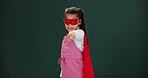 Child, superhero and girl in studio pointing for invitation for you, justice or game mockup. Comic, character and kid in cosplay as villain in fashion with power, action and agreement to fight crime