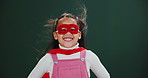 Superhero, character and girl with mask in studio with power on halloween, mockup and wind in space. Scifi, fantasy and kid cosplay as villain in fashion with confidence, pride or fight for justice